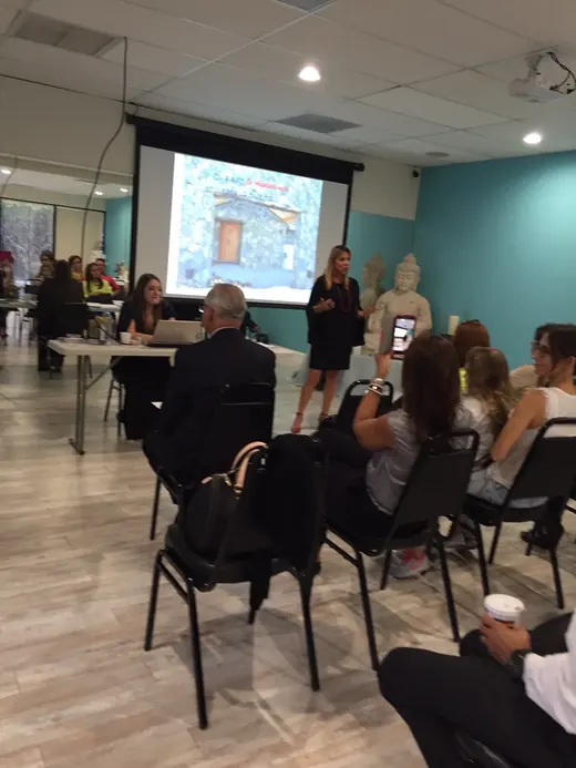 An audience watching a presentation
