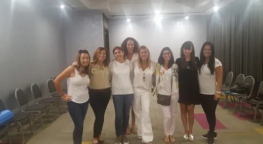 A group of women standing in a room